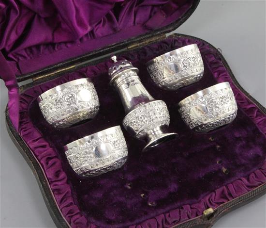 A cased Victorian silver five piece cruet set, Salts diameter 40mm pepper height 82mm Combined weight 3.7oz/106grms
